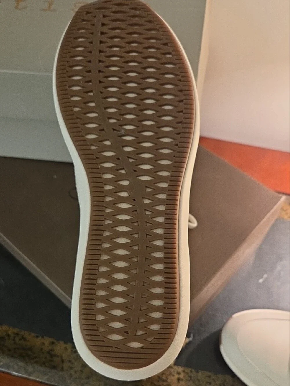 Clarks Cream Leather Sneakers with Brown Heel Accent and Gold Zip